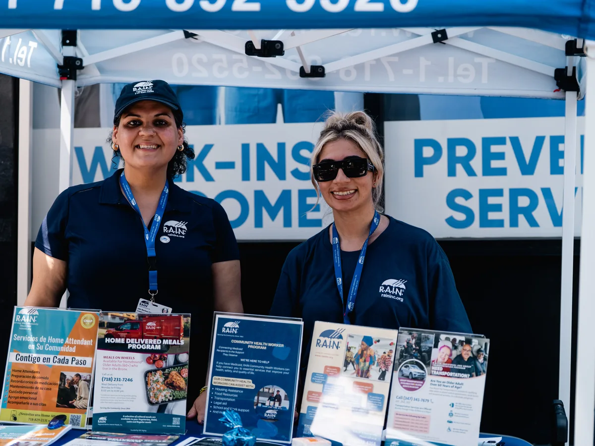 Community partner representatives sharing health information at Summer Health Day
